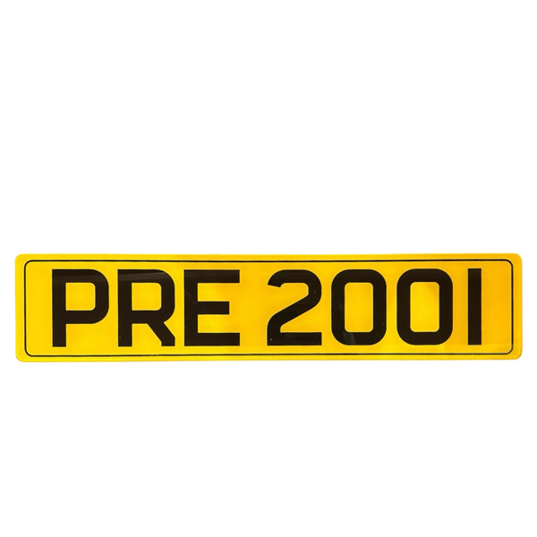 Pre 2001 yellow license plate with black text